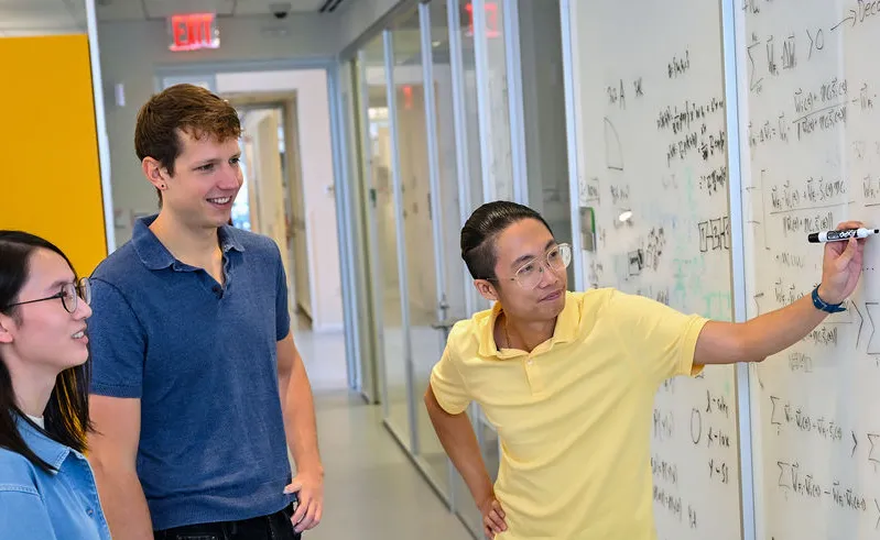 Kavli graduate students Minni Sun, David Clark, and Tuan Nguyen; Photo by Diane Bondareff 